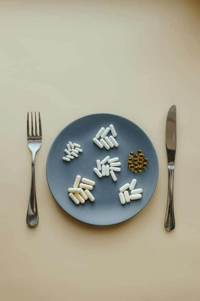 Nutritional supplements and a sports drink on a table